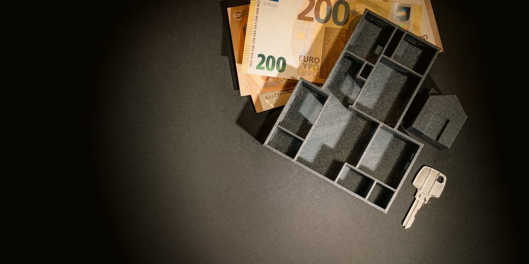 A bunch of keys sitting on top of a pile of money